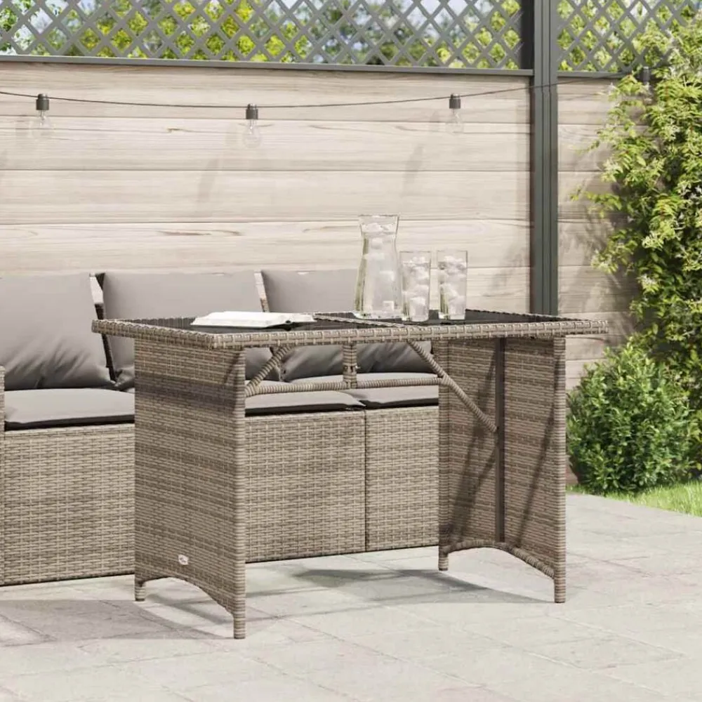 vidaXL Mesa de jardín superficie de vidrio ratán PE 110x68x70 cm Gris Hot
