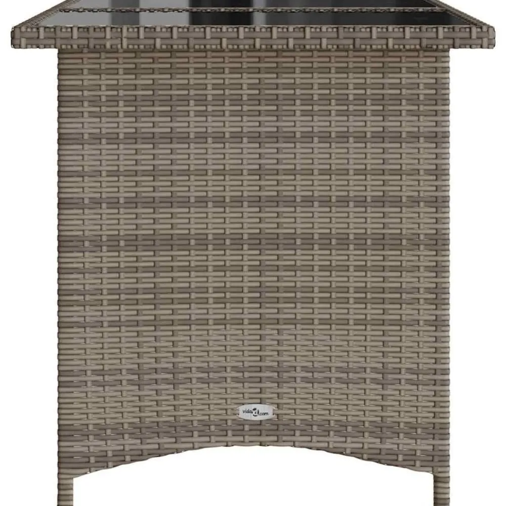 vidaXL Mesa de jardín superficie de vidrio ratán PE 110x68x70 cm Gris Hot